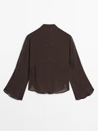 Flowing bib-front shirt with ruffles