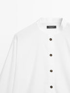 Stand collar shirt with gold buttons