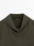 Flowing blouse with draped neck detail