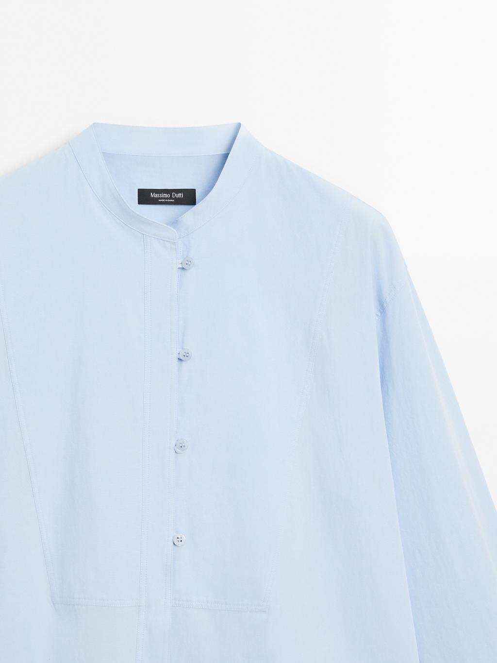 Shirt with stand collar and bib