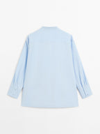 Shirt with stand collar and bib