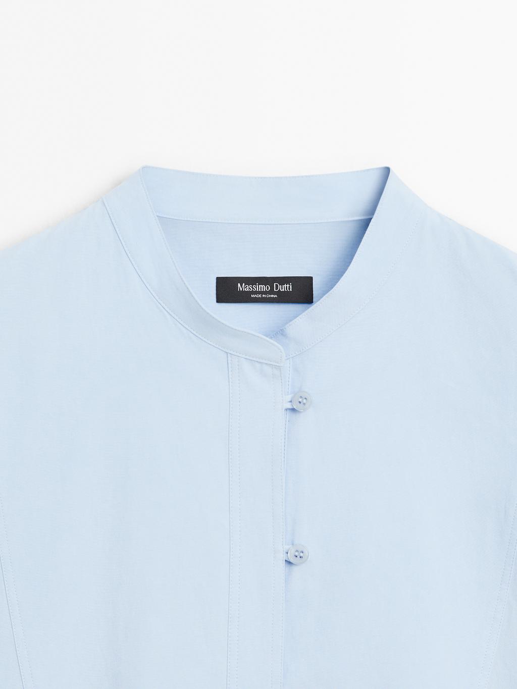 Shirt with stand collar and bib