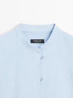 Shirt with stand collar and bib