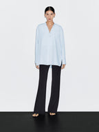 Shirt with stand collar and bib