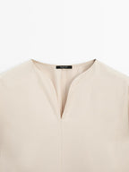 Flowing blouse with slit details