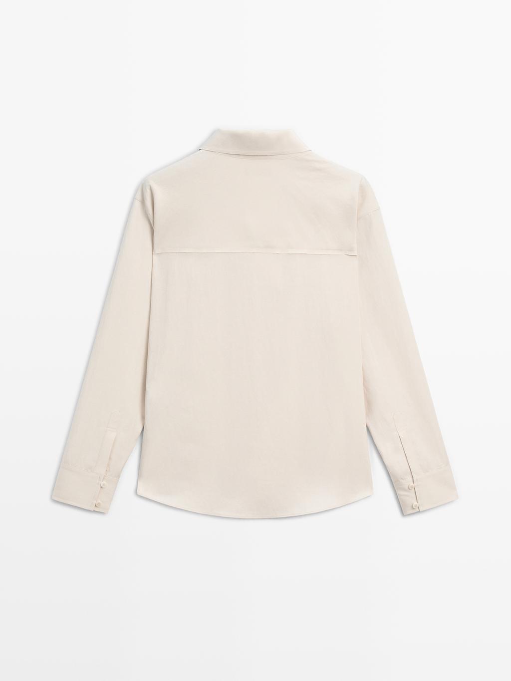 Flowing blouse with button detail