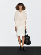 Flowing blouse with button detail