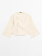 Long sleeve blouse with side button fastening