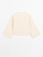 Long sleeve blouse with side button fastening