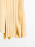 Asymmetric box pleat skirt