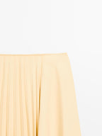 Asymmetric box pleat skirt