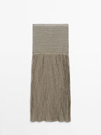 Long pleated skirt with flecked detail