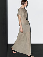 Long pleated skirt with flecked detail