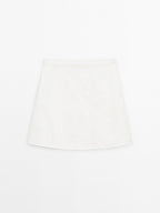 Short denim skirt with seam details