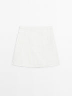 Short denim skirt with seam details
