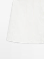 Short denim skirt with seam details