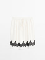 Contrast lace-trimmed skirt