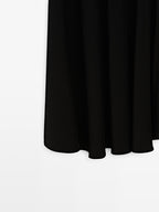 Long flared skirt with button details