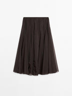 Long voluminous skirt with godet detail