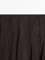 Long voluminous skirt with godet detail