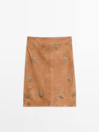Suede leather skirt with rhinestone detail