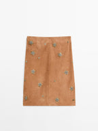 Suede leather skirt with rhinestone detail