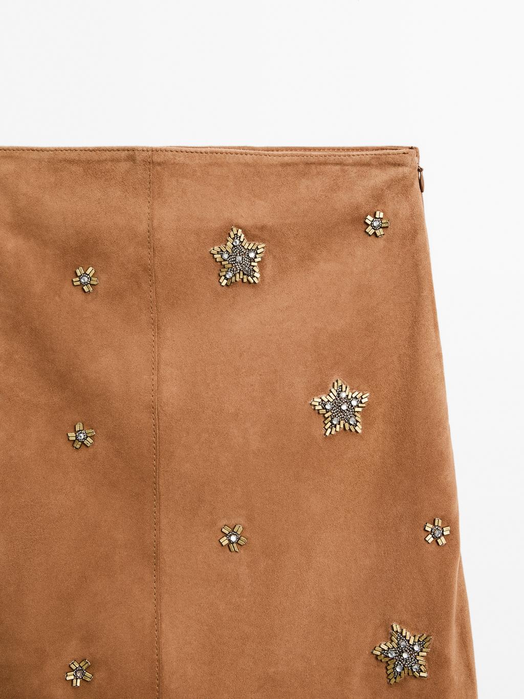 Suede leather skirt with rhinestone detail