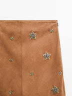 Suede leather skirt with rhinestone detail