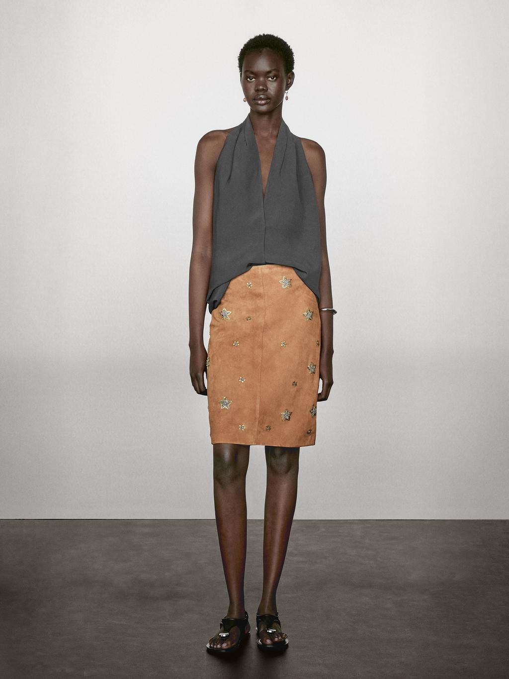 Suede leather skirt with rhinestone detail