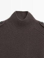 Knit sweater with shoulder detail