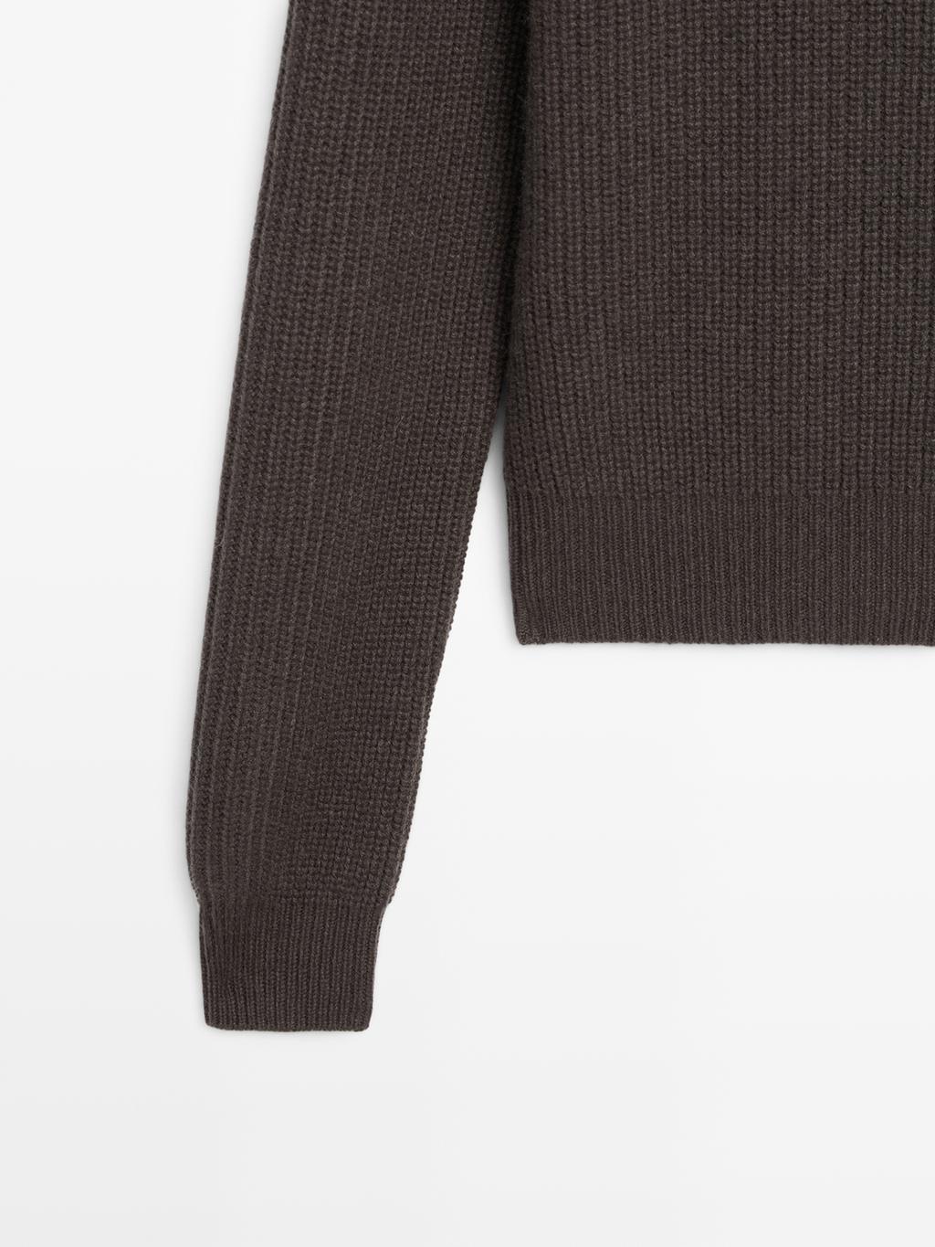 Knit sweater with shoulder detail