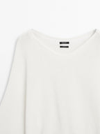 Knit sweater with bow detail