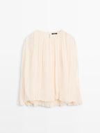 Voluminous flowing blouse
