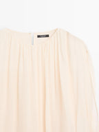 Voluminous flowing blouse