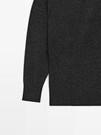 Wool blend knit sweater with asymmetric neckline