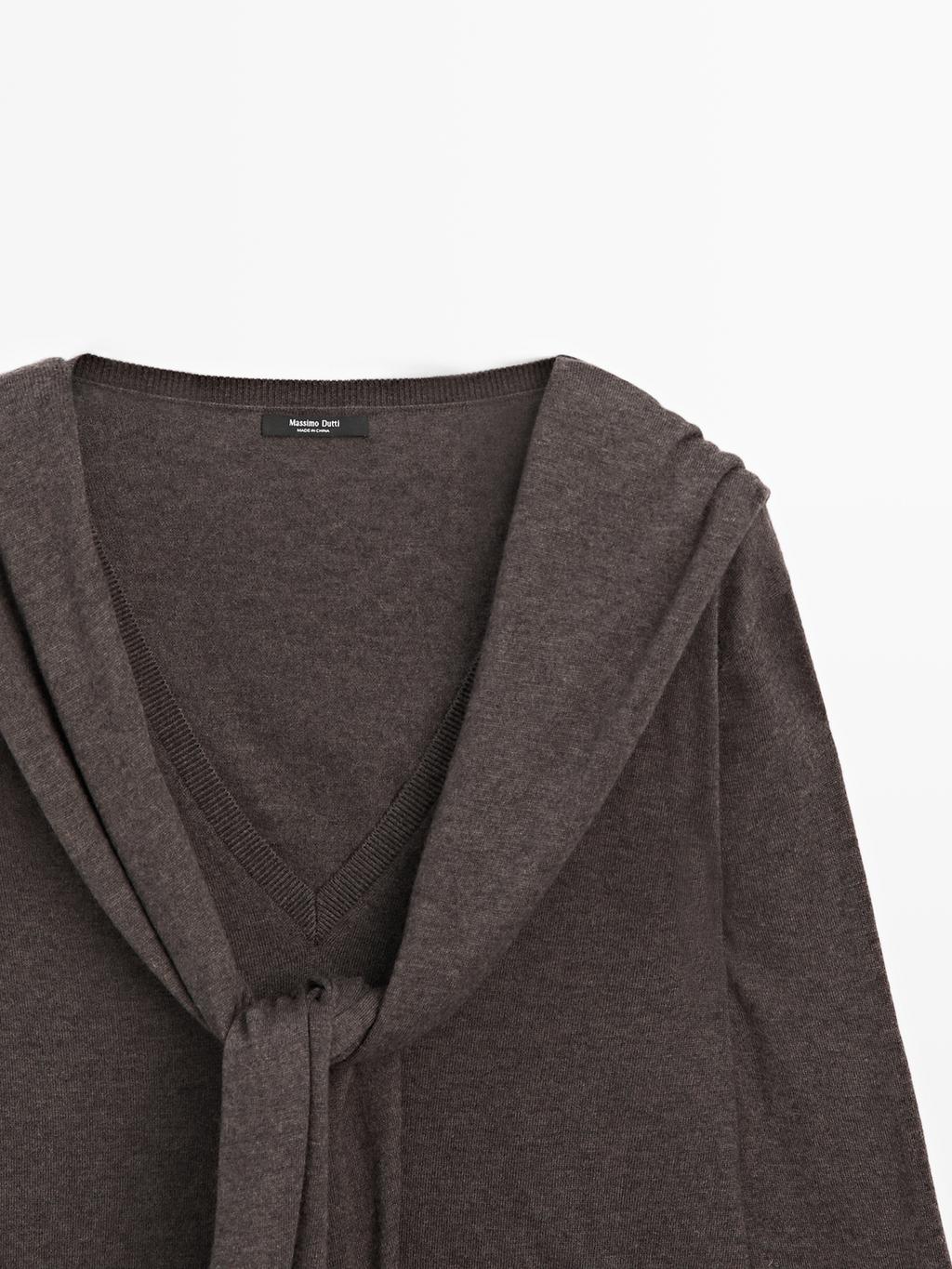 Knit sweater with multiway sleeves