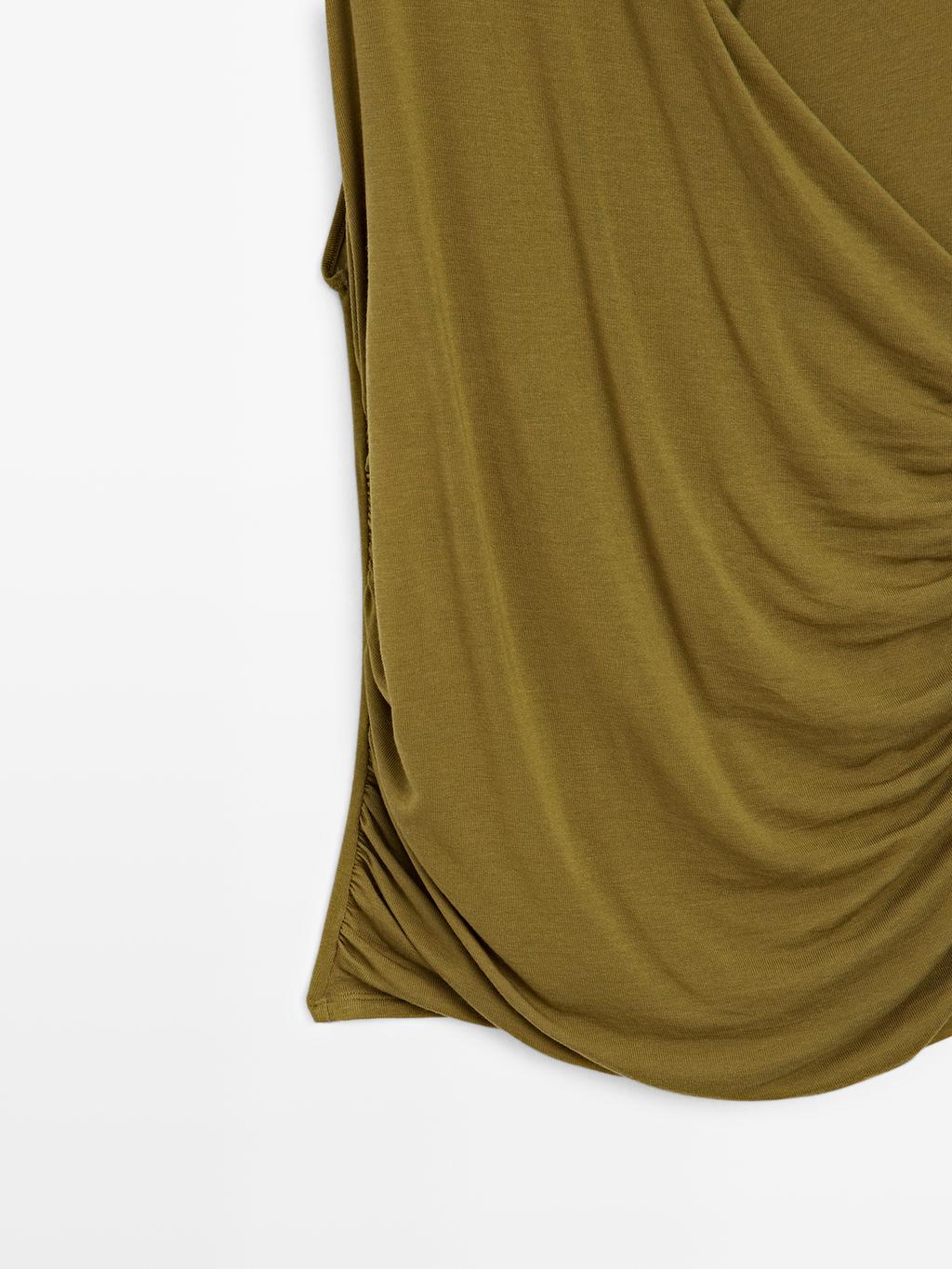 Draped top with surplice neckline