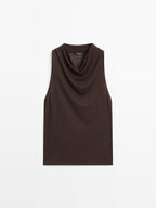 Sleeveless top with draped neckline