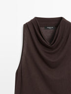 Sleeveless top with draped neckline