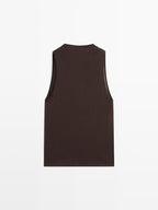 Sleeveless top with draped neckline