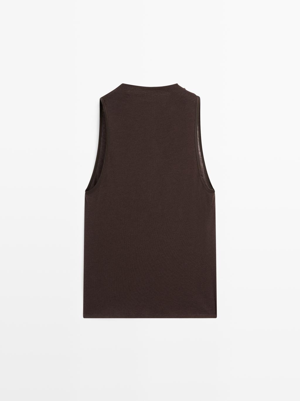 Sleeveless top with draped neckline