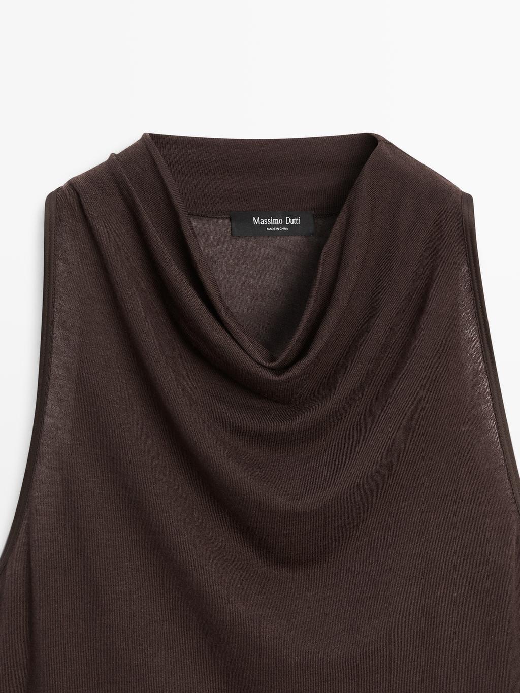 Sleeveless top with draped neckline
