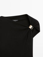 Sleeveless draped top with shoulder applique