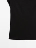 Sleeveless draped top with shoulder applique