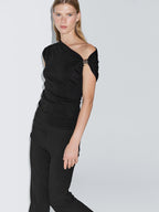 Sleeveless draped top with shoulder applique