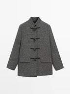 Mid-length coat with horn toggle