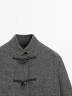 Mid-length coat with horn toggle