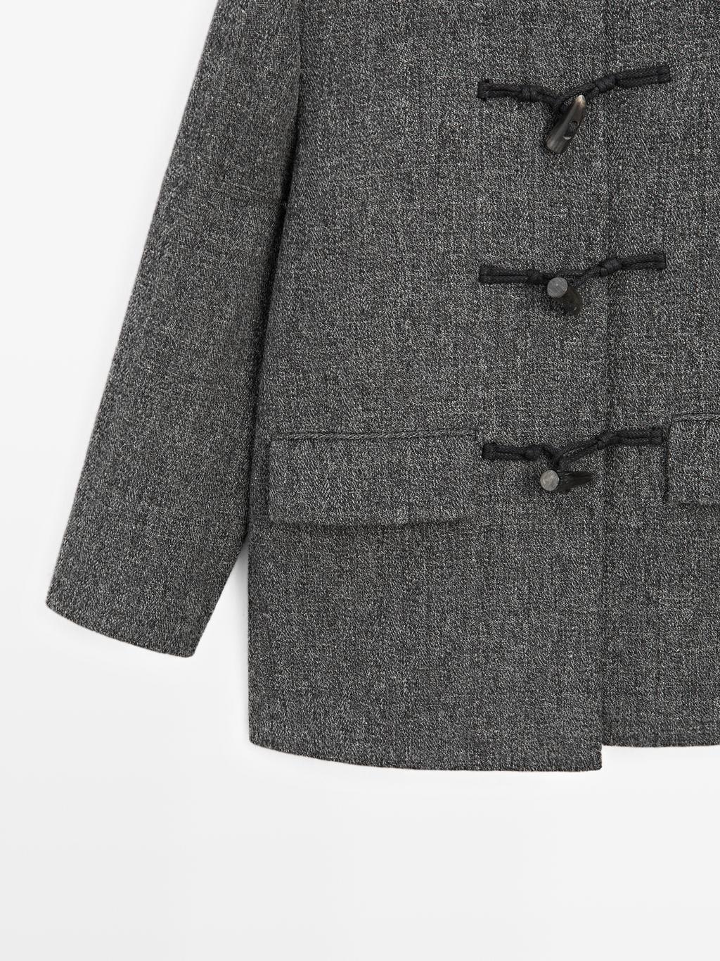 Mid-length coat with horn toggle