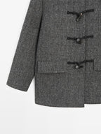 Mid-length coat with horn toggle