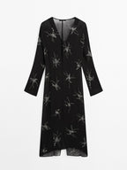 Flowing midi dress with embroidery